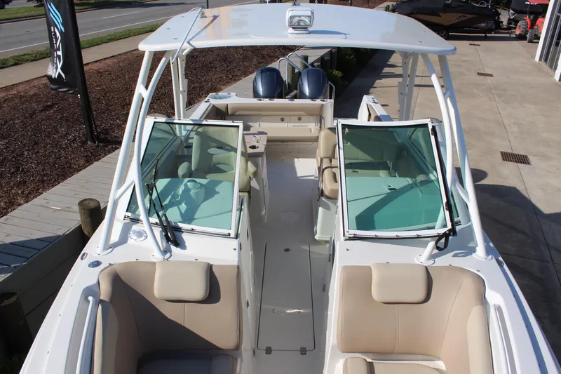 Slide: The Image of 2017 Sailfish 275 DC boat with open cockpit and seating, viewed from above. - 17