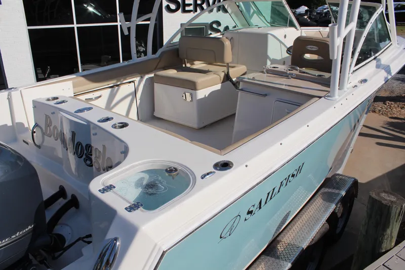Slide: The Image of 2017 Sailfish 275 DC boat with seating and fishing amenities. - 8