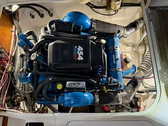 Slide: The Image of Engine room of a 1984 Bertram 30 with blue 454 engine. - 14