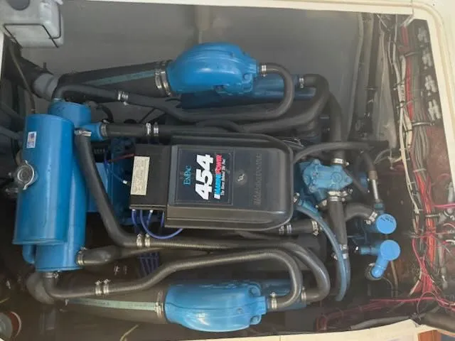 Slide: The Image of Engine compartment of a 1984 Bertram 30 with blue 454 engine. - 15