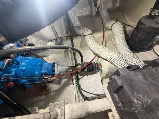 Slide: The Image of Engine room of a 1984 Bertram 30 boat with blue machinery. - 17