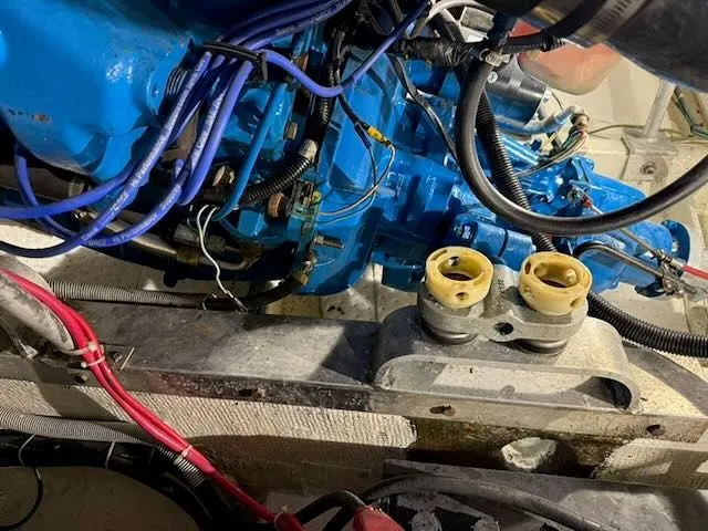 Slide: The Image of Engine compartment of a 1984 Bertram 30 with blue wiring. - 18