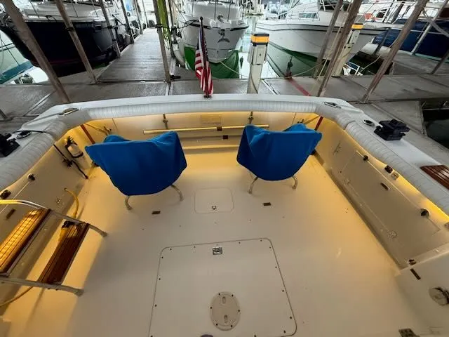 Slide: The Image of Interior of a 1984 Bertram 30 boat with blue chairs. - 2
