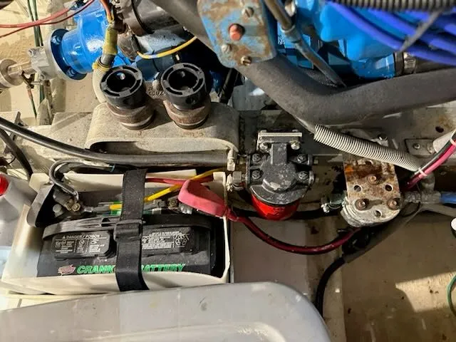 Slide: The Image of Engine compartment of a 1984 Bertram 30 boat with battery and wiring. - 20