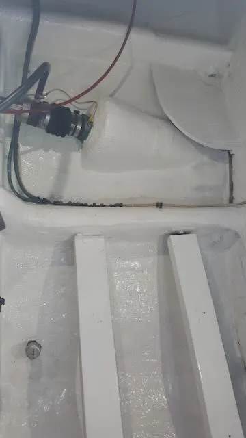 Slide: The Image of Interior of a 1984 Bertram 30 boat, showing cables and structure. - 22