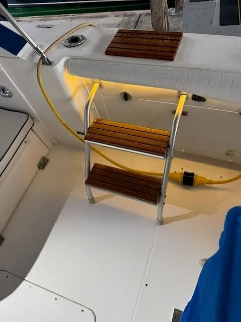 Slide: The Image of Interior of a 1984 Bertram 30 yacht with illuminated steps. - 28