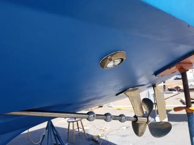 Slide: The Image of Propeller of a 1984 Bertram 30 boat, painted blue. - 31