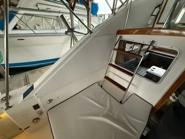 Slide: The Image of Interior view of a 1984 Bertram 30 yacht with seating area. - 4