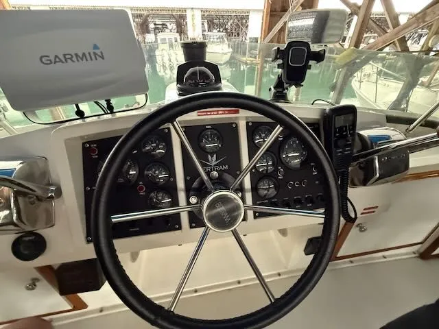 Slide: The Image of 1984 Bertram 30 boat helm with Garmin navigation system. - 6