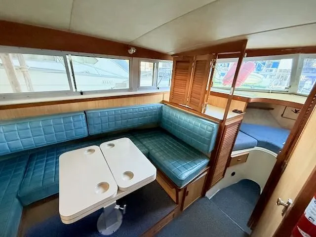 Slide: The Image of Interior of a 1984 Bertram 30 yacht with blue upholstery. - 9