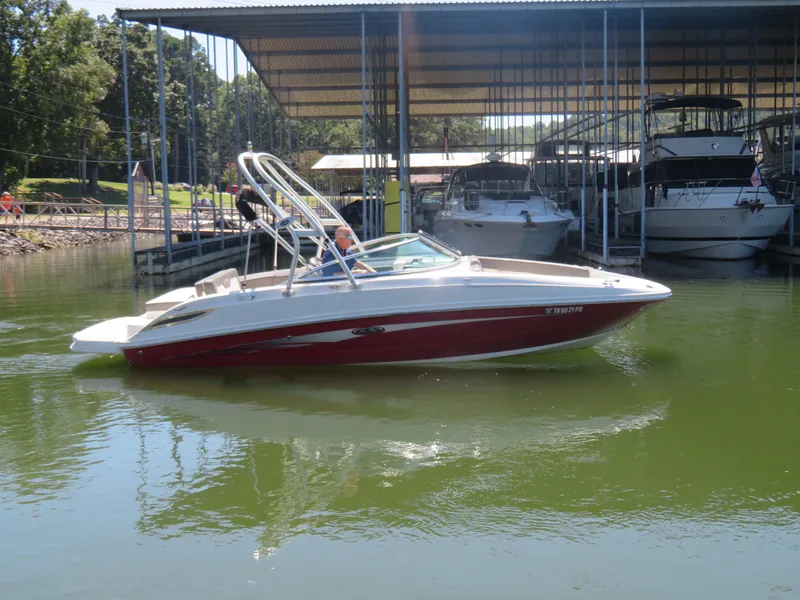 The Image of 2011 Sea Ray 240 Sundeck boat docked in marina. - 1