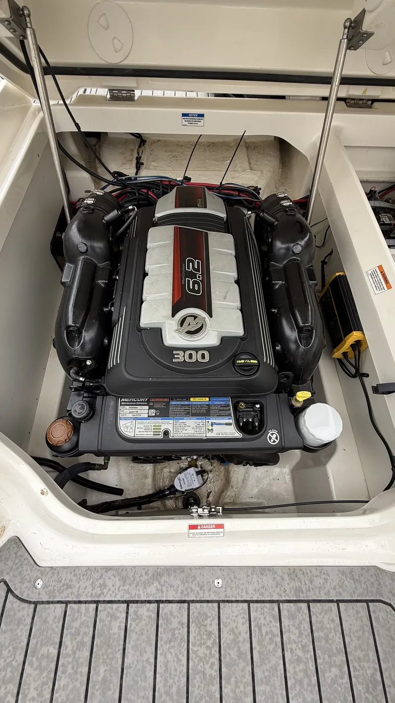Slide: The Image of Engine compartment of a 2021 Sea Ray SDX250 boat with 6.2L 300 HP engine. - 10