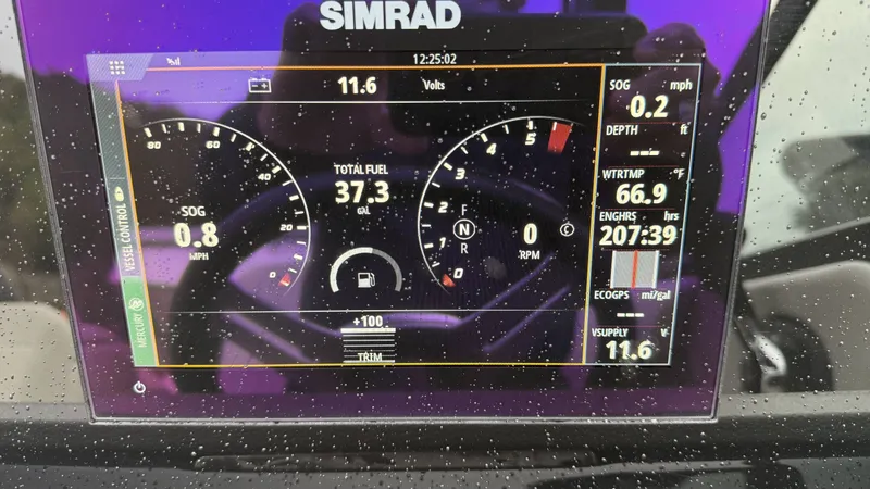 Slide: The Image of Simrad display on Sea Ray SDX250 showing boat data and fuel level. - 12