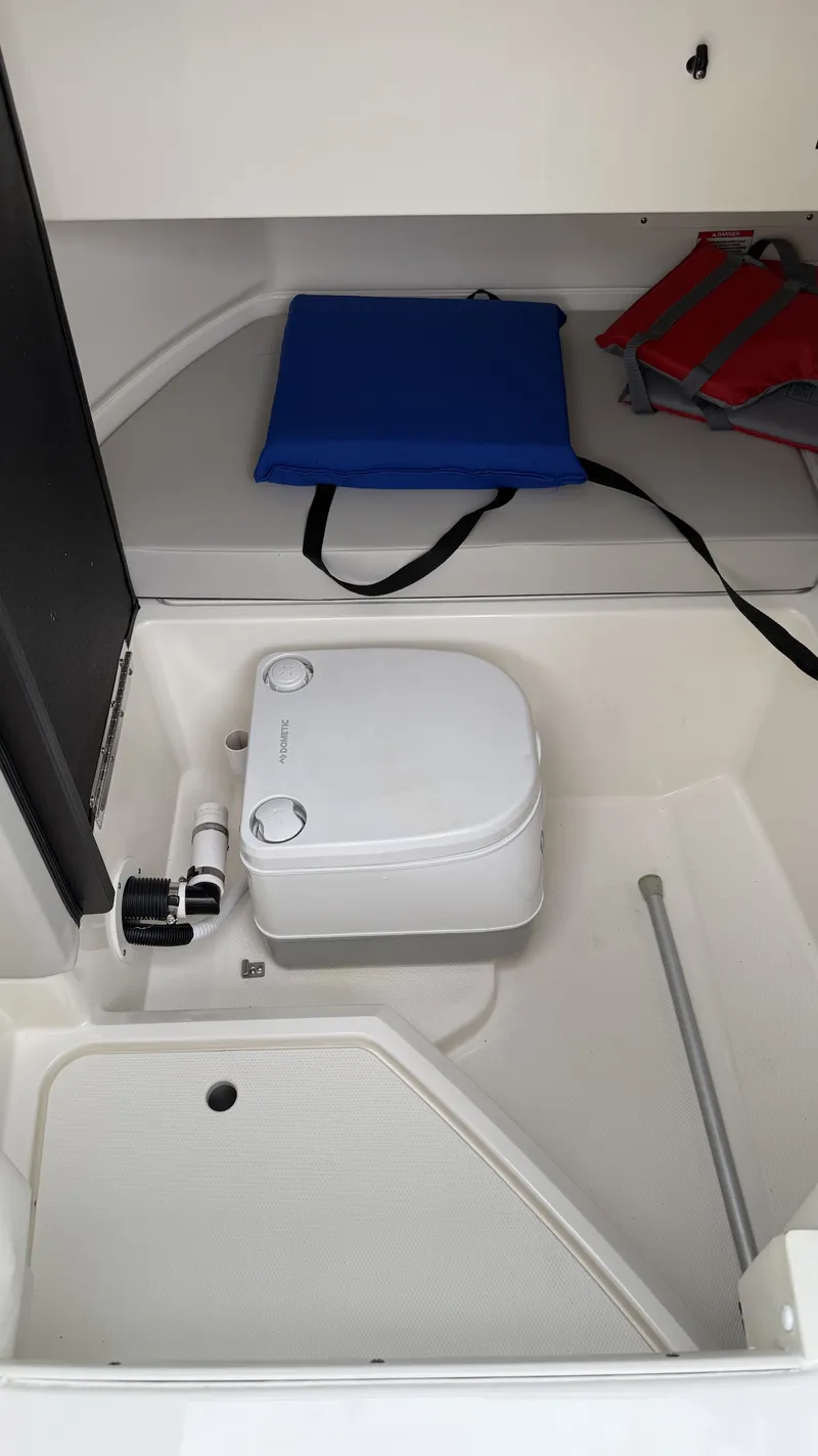 Slide: The Image of Interior of a 2021 Sea Ray SDX250 with portable toilet. - 15