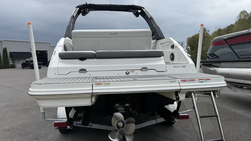 Slide: The Image of Rear view of a 2021 Sea Ray SDX250 boat on a trailer. - 5