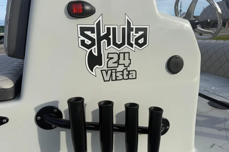 Slide: The Image of Skuta Vista 24 boat console with rod holders, 2026 model. - 4
