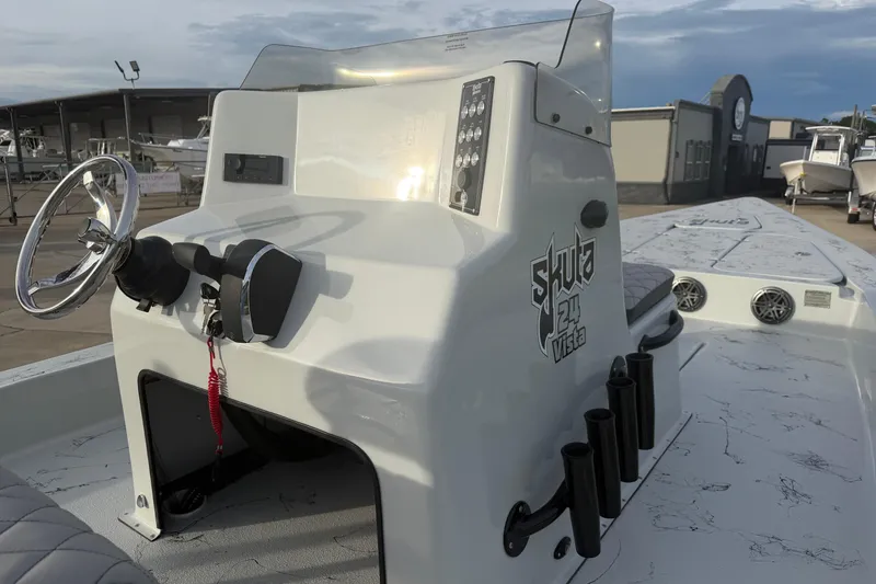 Slide: The Image of 2026 Skuta Vista 24 boat console with steering wheel and control panel. - 9