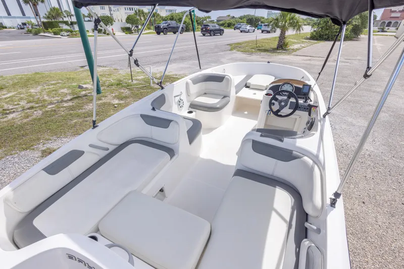 Slide: The Image of 2015 Bayliner Element XL boat interior with seating and steering console. - 19