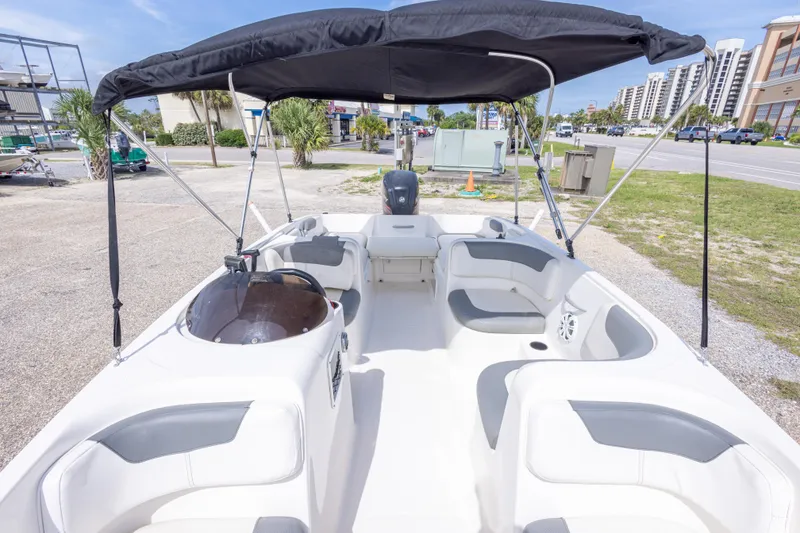 Slide: The Image of 2015 Bayliner Element XL boat with canopy, spacious seating, and modern design. - 27