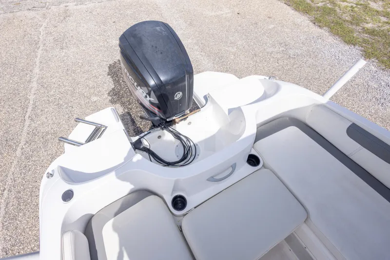 Slide: The Image of 2015 Bayliner Element XL boat with Mercury outboard motor, featuring spacious seating and sleek design. - 33