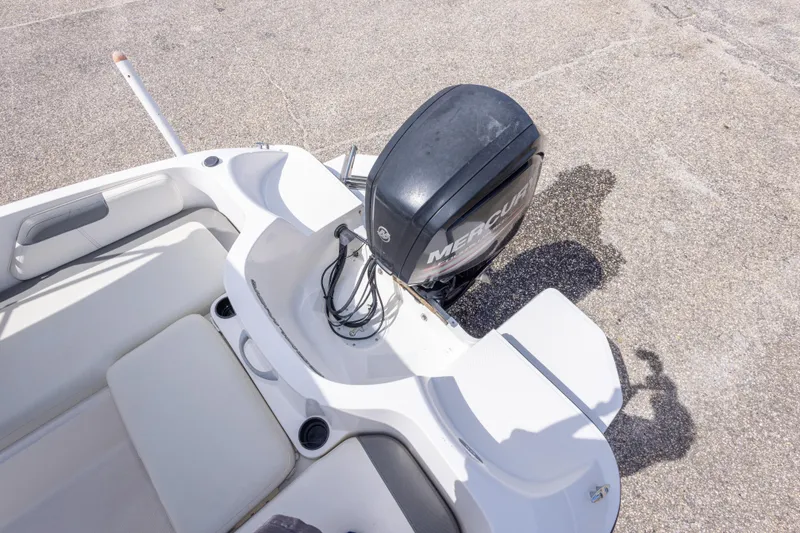 Slide: The Image of 2015 Bayliner Element XL boat with Mercury outboard motor, white interior seating. - 34