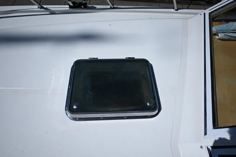 Slide: The Image of Hatch on 1999 McKinna 47 Sedan yacht deck, featuring sleek design and sturdy construction. - 14