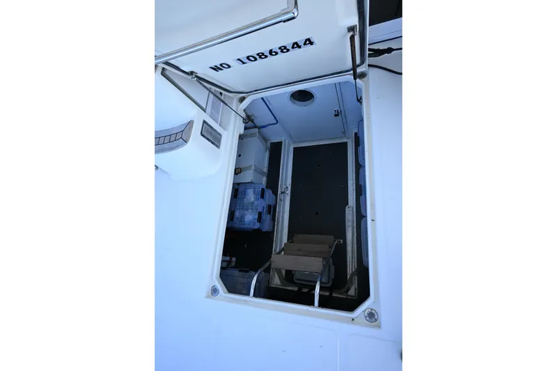 Slide: The Image of Engine compartment of a 1999 McKinna 47 Sedan yacht, showing interior details. - 41