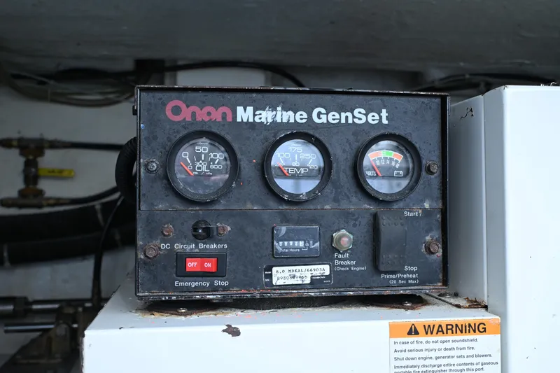 Slide: The Image of Onan Marine GenSet control panel on 1999 McKinna 47 Sedan yacht. - 46