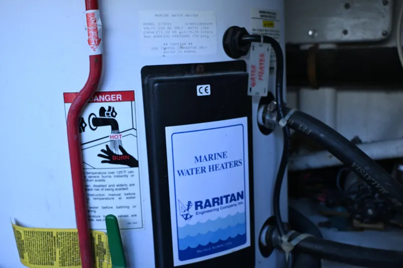 Slide: The Image of Marine water heater in a 1999 McKinna 47 Sedan boat engine room. - 47