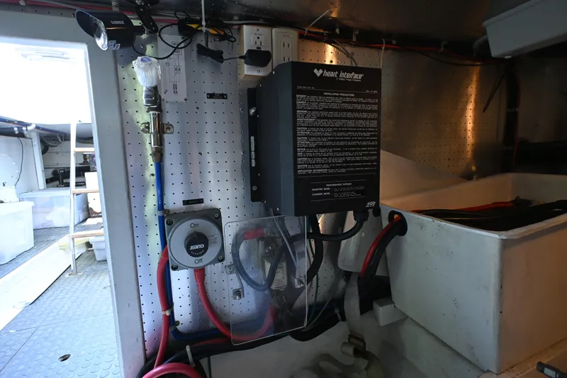 Slide: The Image of Electrical system setup in a 1999 McKinna 47 Sedan yacht engine room. - 53