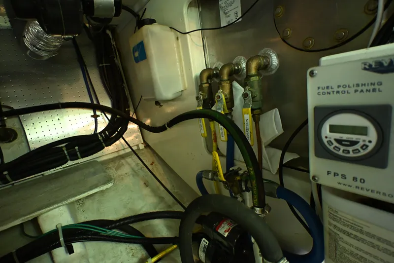 Slide: The Image of Engine room of a 1999 McKinna 47 Sedan with fuel polishing control panel. - 61