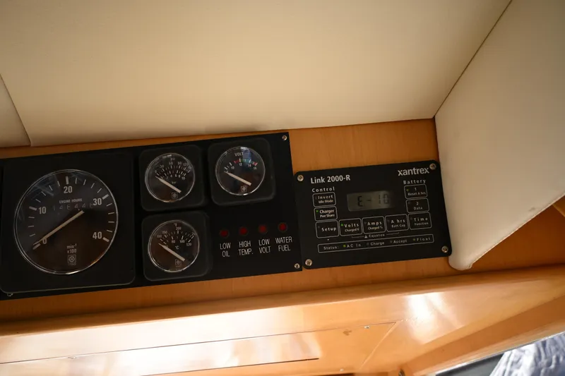 Slide: The Image of Control panel of a 1999 McKinna 47 Sedan with gauges and Xantrex Link 2000-R. - 70