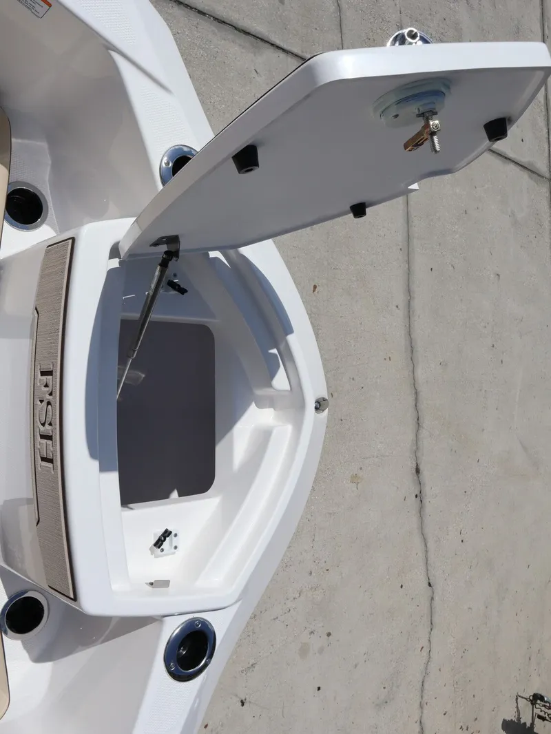 Slide: The Image of Yamaha Boats 2026 255 FSH Sport H storage compartment open. - 14