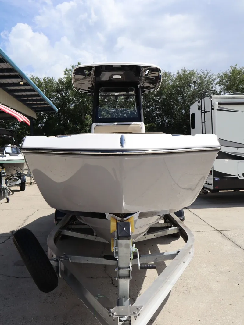 Slide: The Image of 2026 Yamaha Boats 255 FSH Sport H on trailer, front view. - 3