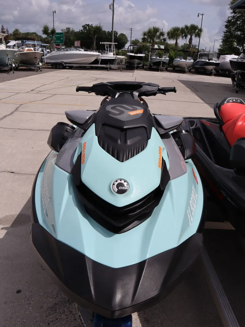 Slide: The Image of 2022 Sea-Doo GTI SE 170 jet ski in parking lot. - 11