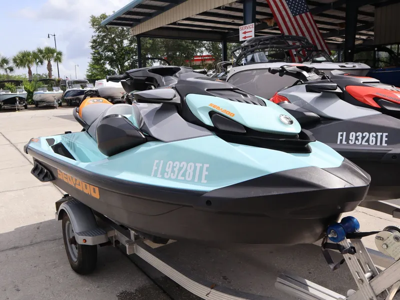 Slide: The Image of 2022 Sea-Doo GTI SE 170 jet ski on trailer, blue and black, parked outdoors. - 3