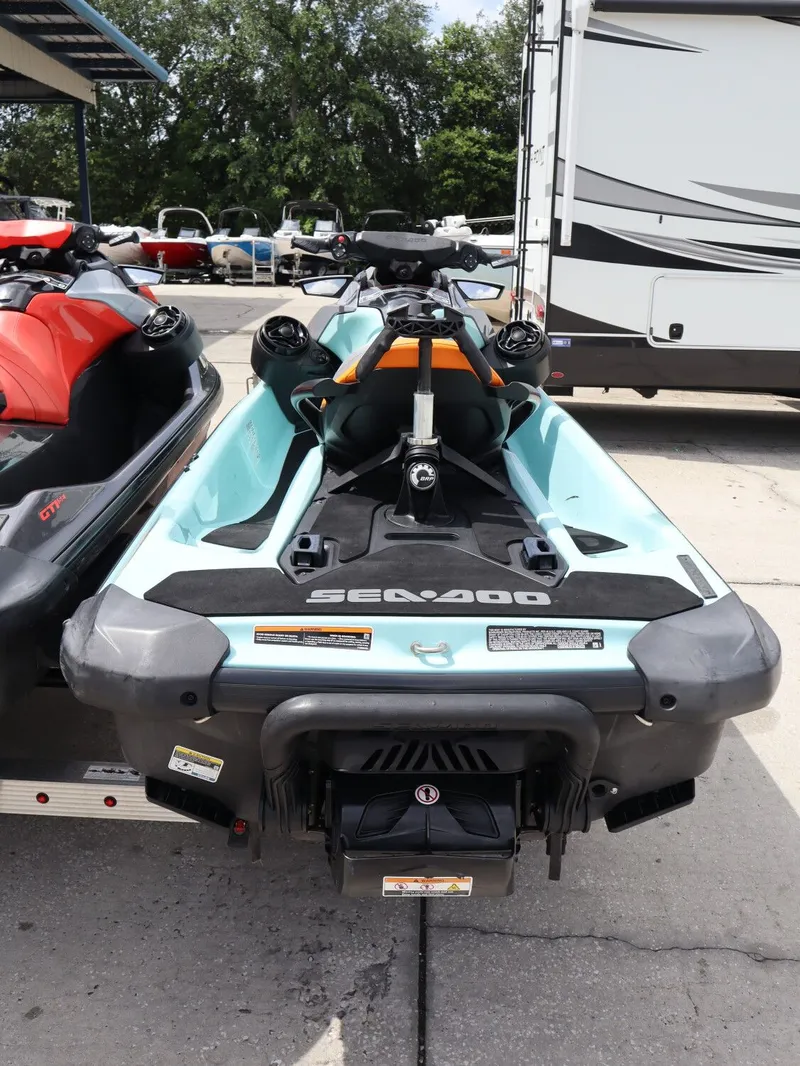 Slide: The Image of 2022 Sea-Doo GTI SE 170 jet ski parked outdoors. - 7
