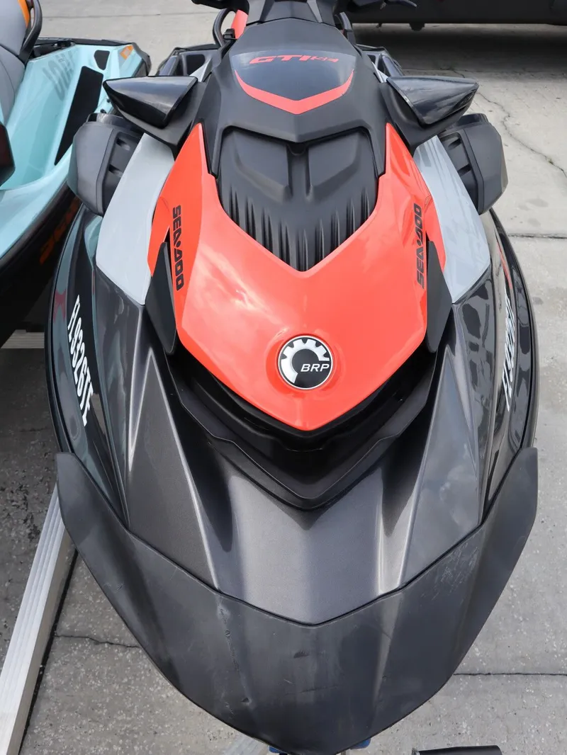 Slide: The Image of 2022 Sea-Doo GTI 130 jet ski in black and orange. - 10