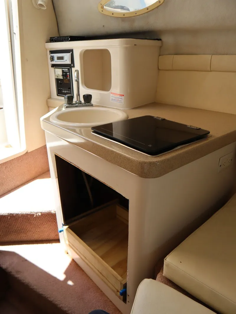 Slide: The Image of Interior of 1998 Monterey 242 Cruiser with sink and storage. - 15