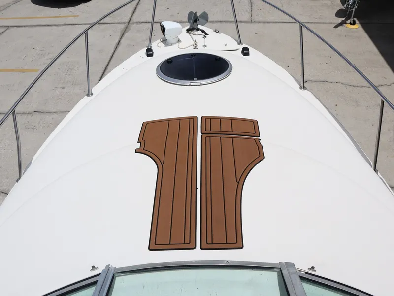 Slide: The Image of 1998 Monterey 242 Cruiser boat deck with wood inlay. - 18