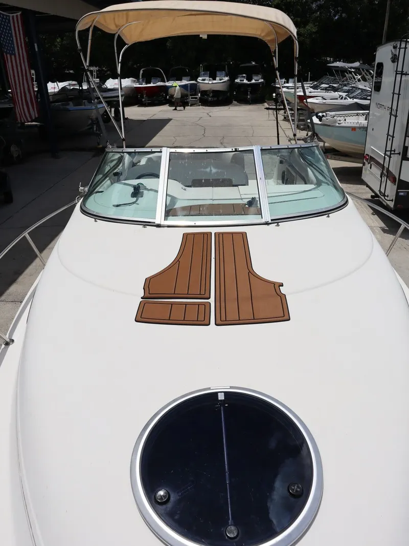 Slide: The Image of 1998 Monterey 242 Cruiser with sunshade at the marina. - 20
