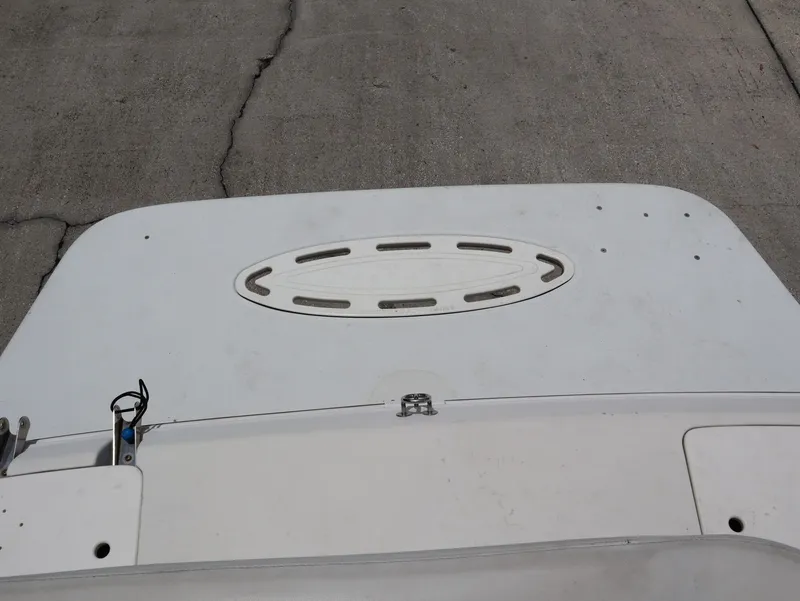 Slide: The Image of Stern of a 1998 Monterey 242 Cruiser boat on concrete. - 22