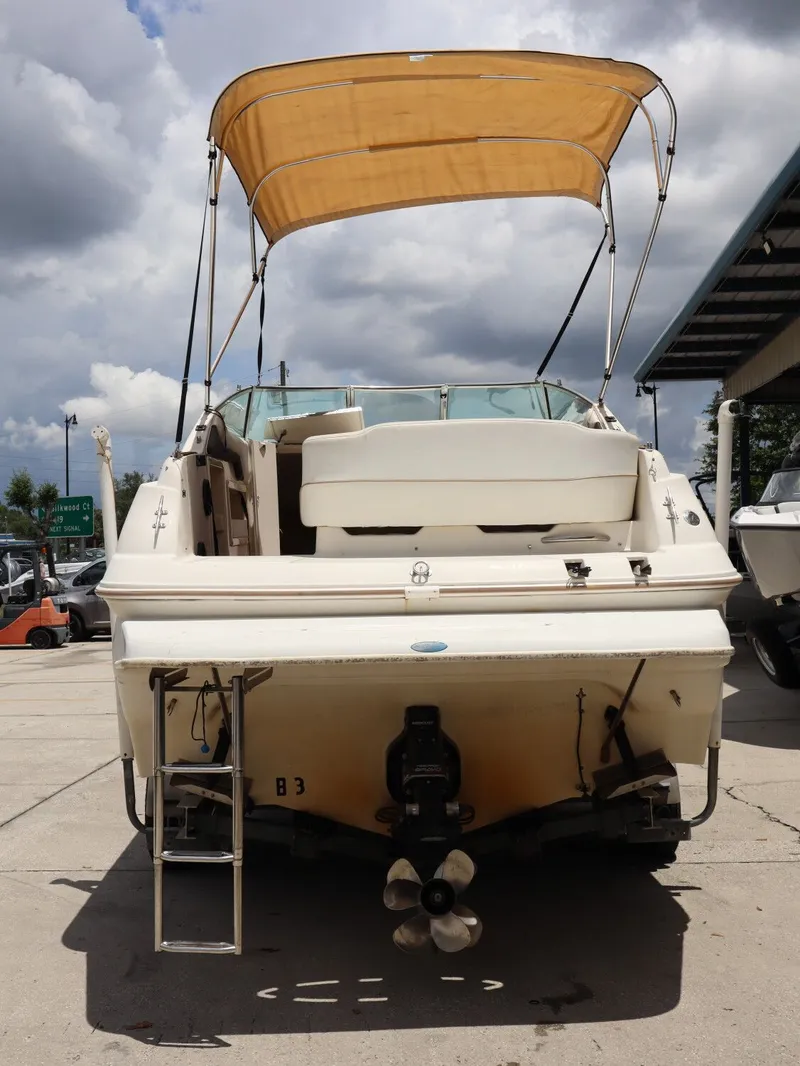 Slide: The Image of Rear view of a 1998 Monterey 242 Cruiser with sun canopy. - 7