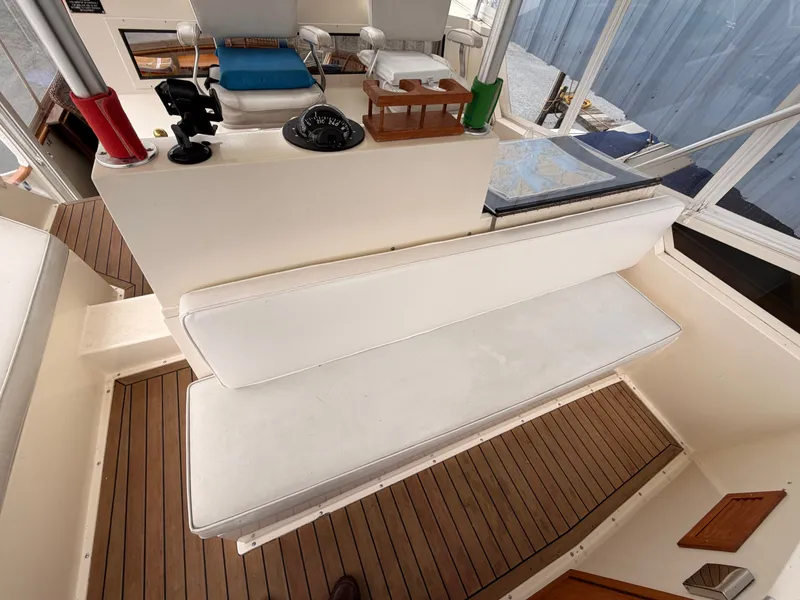Slide: The Image of Interior of a 1987 Viking DBL Cabin Motor Yacht with helm station. - 11