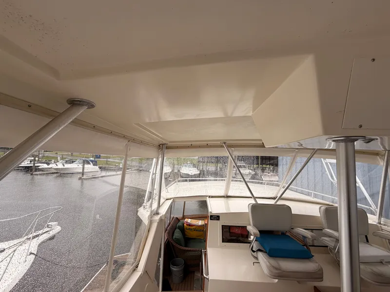 Slide: The Image of Interior view of a 1987 Viking DBL Cabin Motor Yacht at the marina. - 13