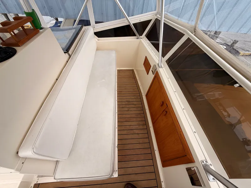 Slide: The Image of Interior of a 1987 Viking DBL Cabin Motor Yacht with wooden flooring. - 15