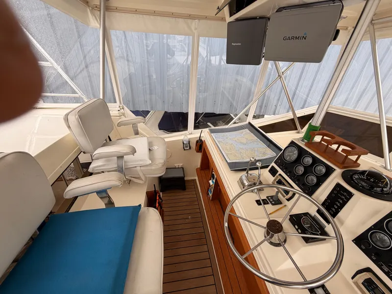 Slide: The Image of Interior of a 1987 Viking DBL Cabin Motor Yacht with helm station. - 18