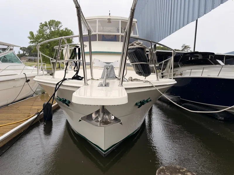 Slide: The Image of 1987 Viking DBL Cabin Motor Yacht docked at marina. - 2