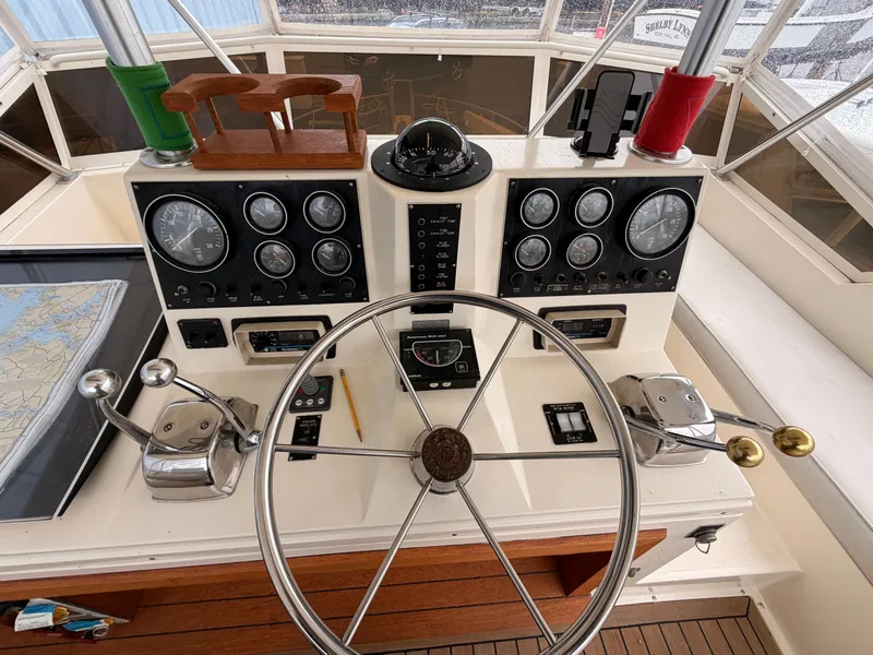 Slide: The Image of Helm of a 1987 Viking DBL Cabin Motor Yacht with instruments. - 24