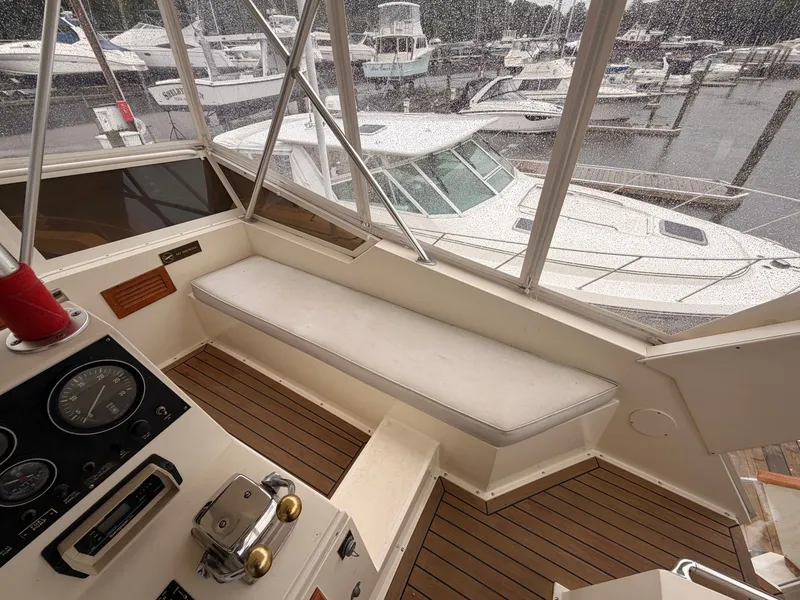 Slide: The Image of Interior of a 1987 Viking DBL Cabin Motor Yacht at the marina. - 29
